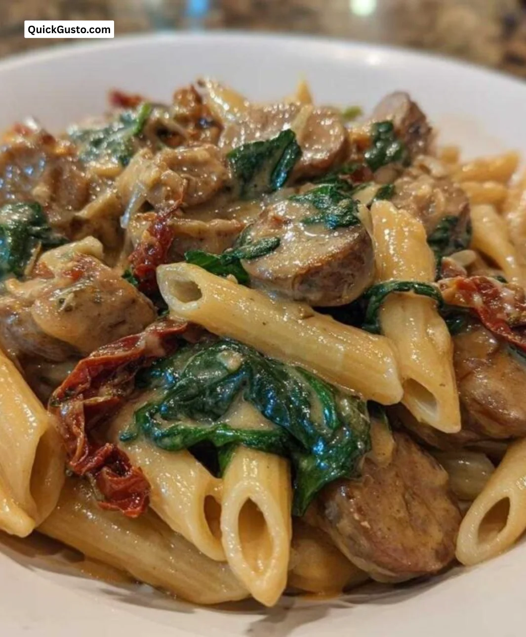 1-Pan Chicken Sausage Pasta with colorful vegetables in a skillet