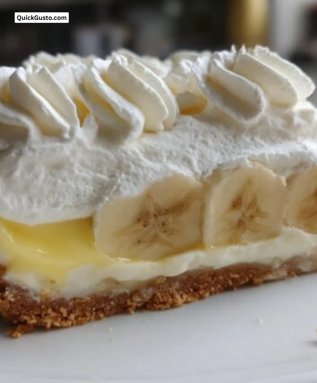 Slice of 350 calorie banana cream pie with whipped cream topping