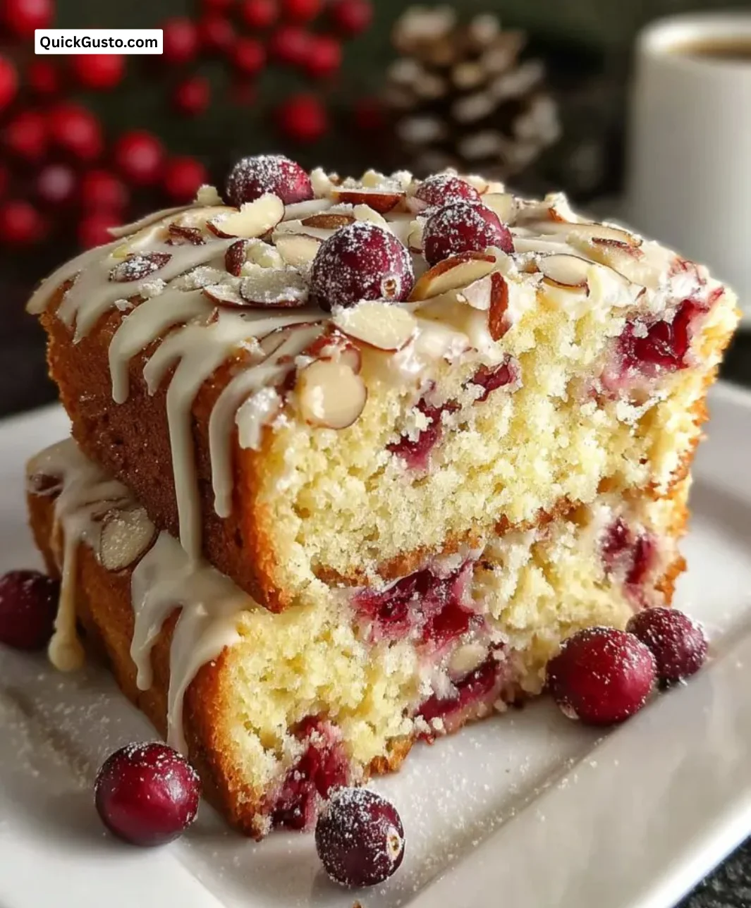 Sliced Almond Cranberry Cake topped with fresh cranberries and almonds