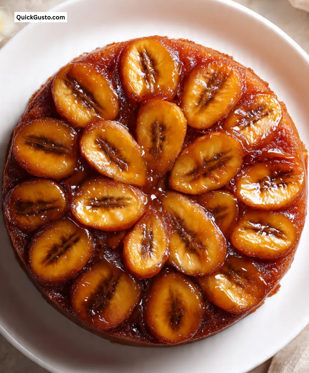 Delicious Banana Foster Upside Down Cake topped with caramelized bananas and nuts