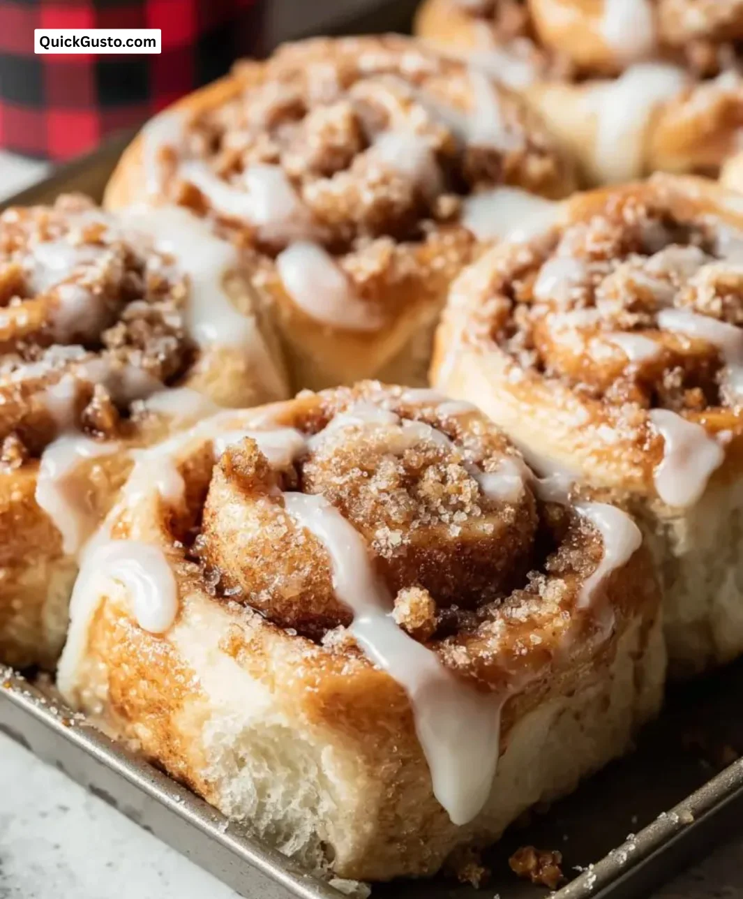 Delicious brown butter cinnamon rolls drizzled with icing.