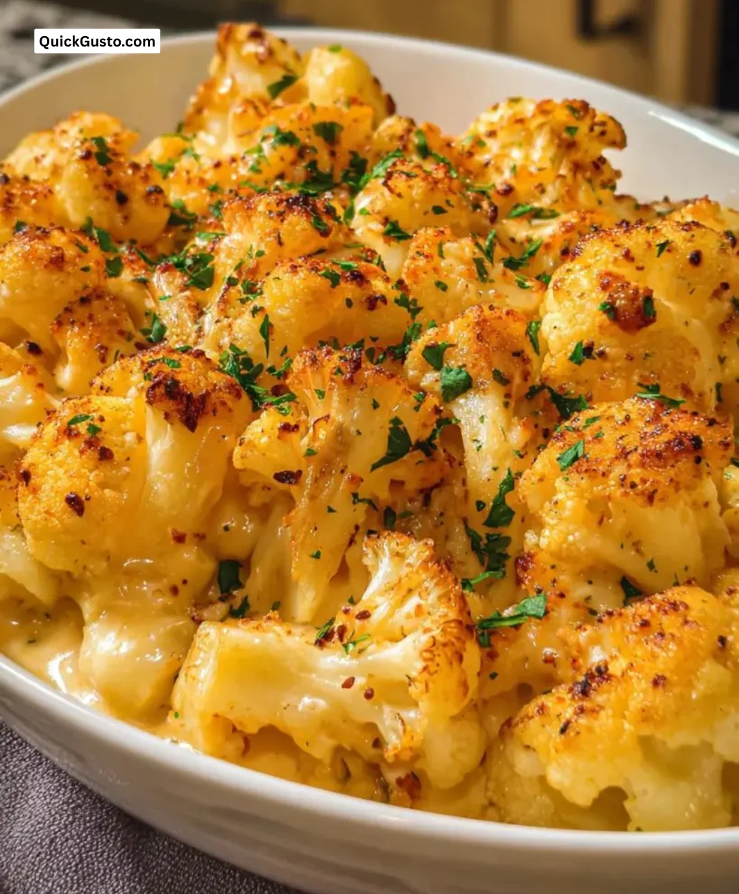 Delicious bowl of creamy Cauliflower Mac Cheese topped with breadcrumbs.
