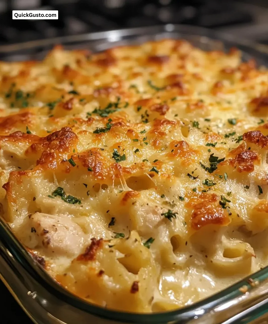Cheesy Baked Chicken Alfredo Casserole topped with melted cheese