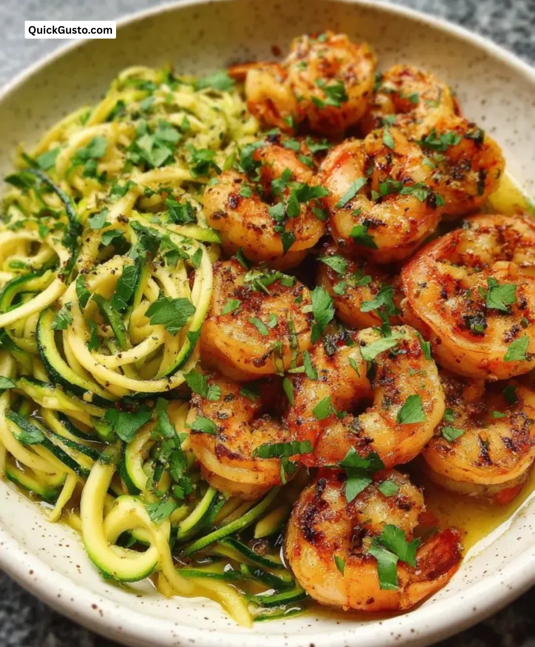 Citrus grilled shrimp zoodles served with vibrant vegetables on a plate