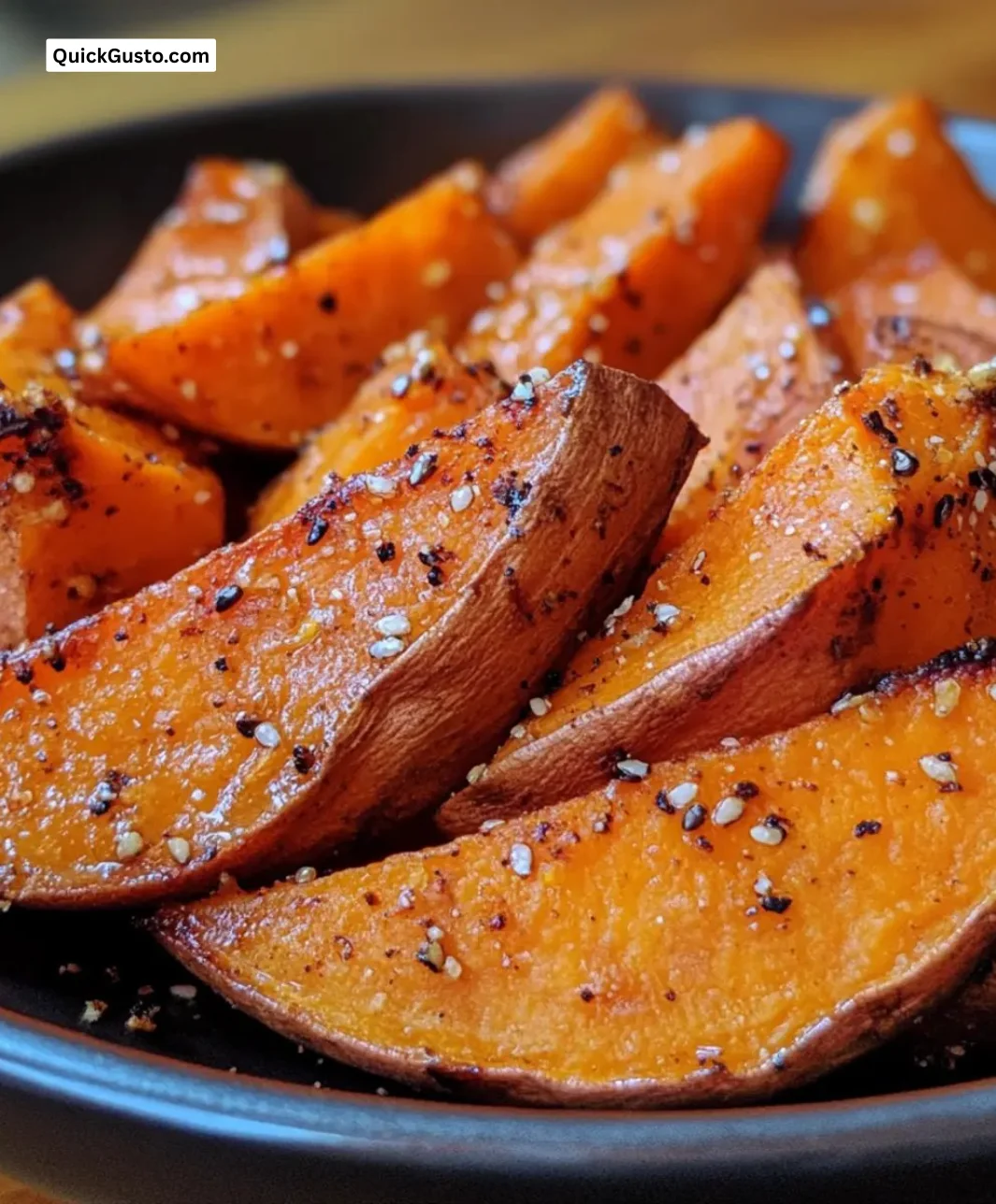 Crispy roasted sweet potato wedges served on a plate