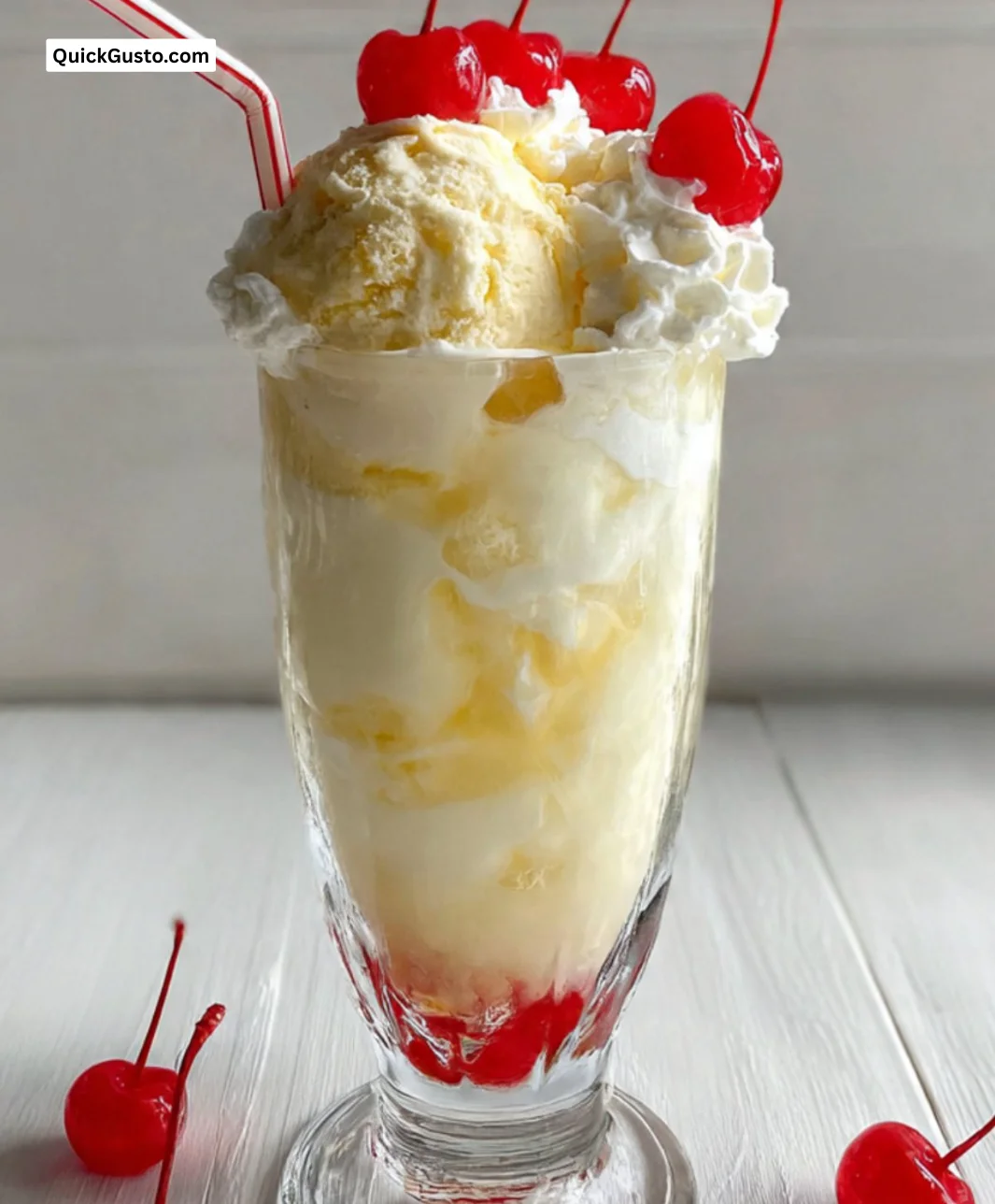 Delicious Dirty Shirley Float cocktail served in a chilled glass with cherry and straw.