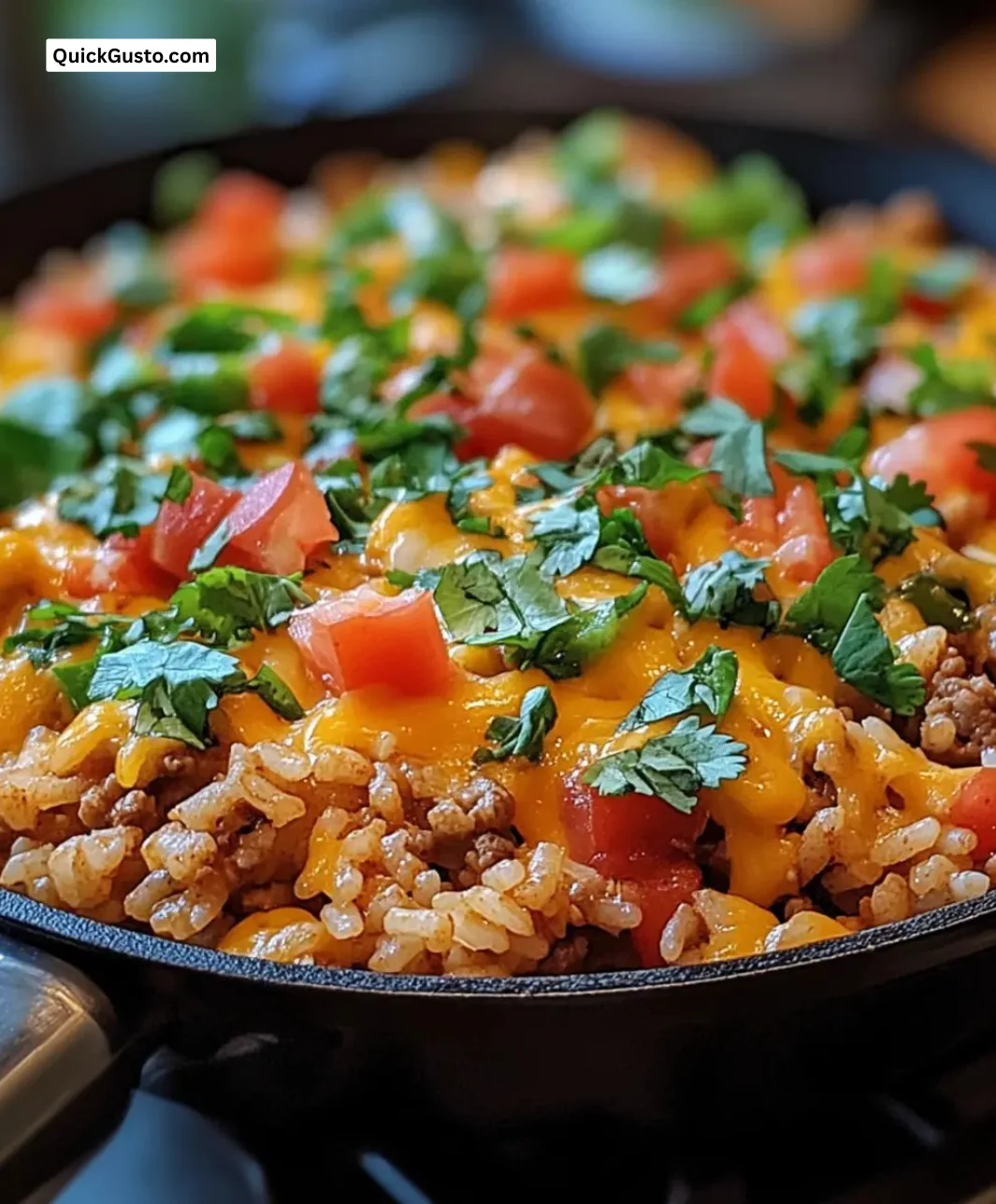 Easy cheesy taco rice skillet with colorful ingredients in a pan