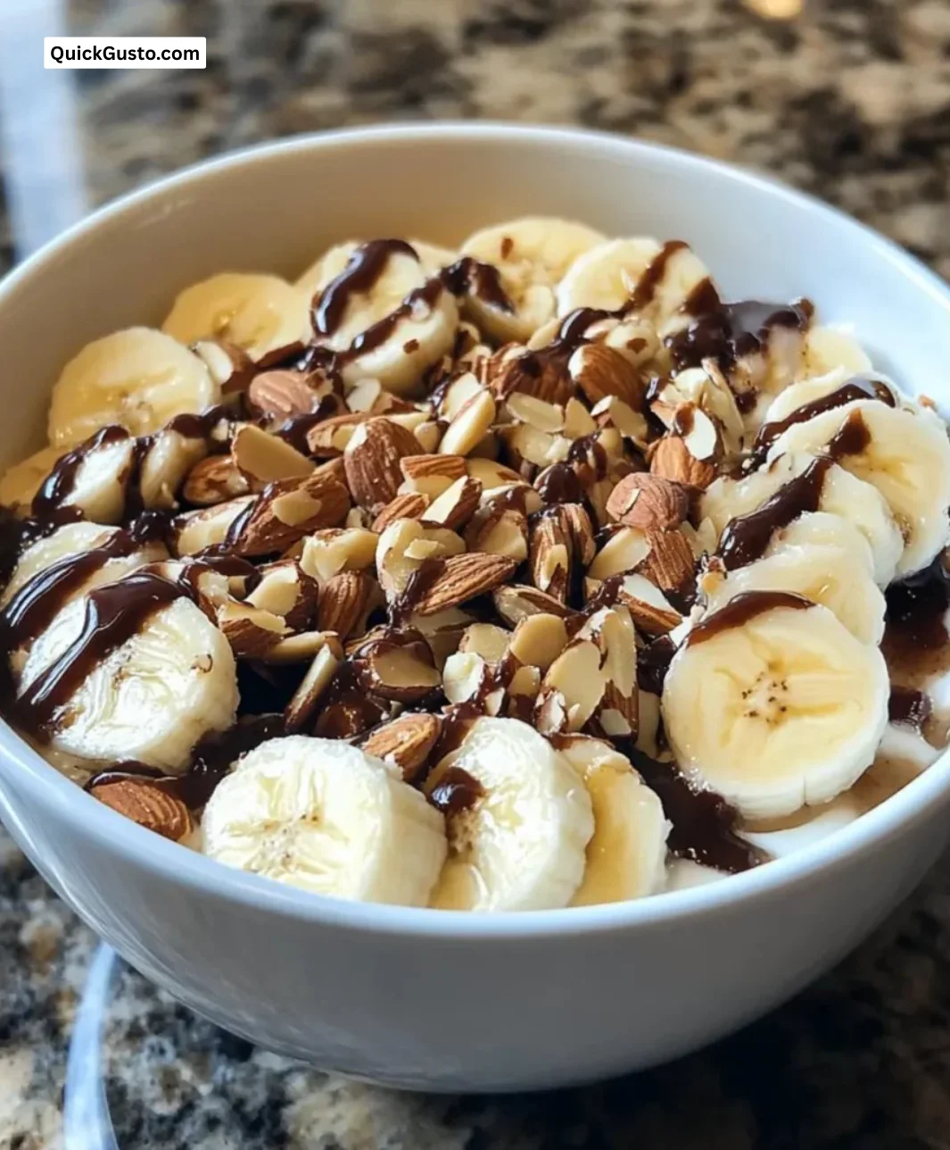 Delicious gluten-free banana almond breakfast bowl topped with fresh fruits