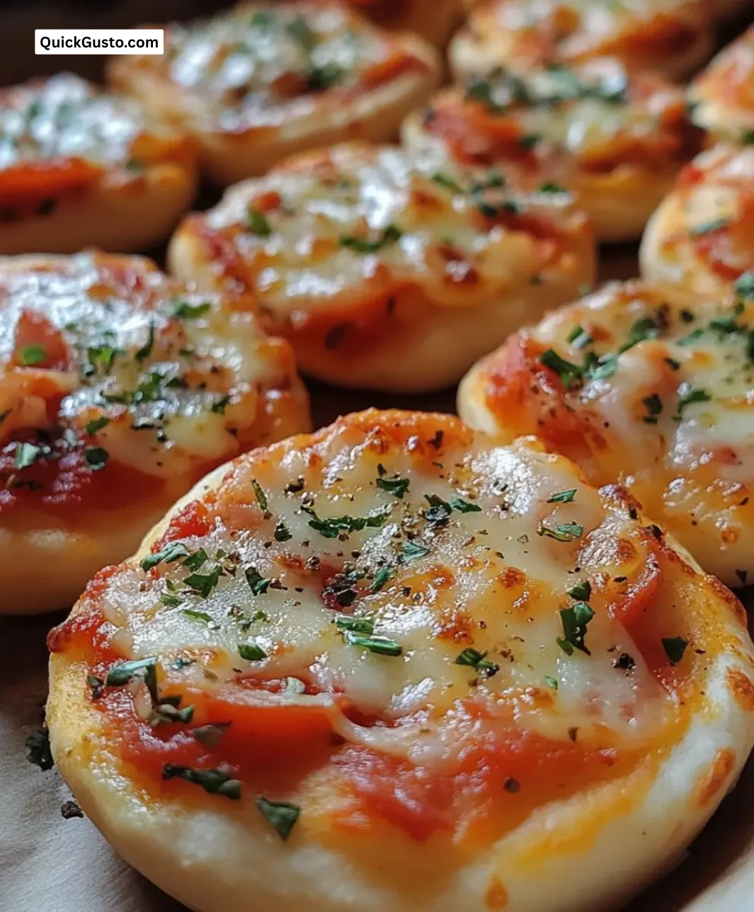 Easy mini pita pizza bites topped with cheese and vegetables.