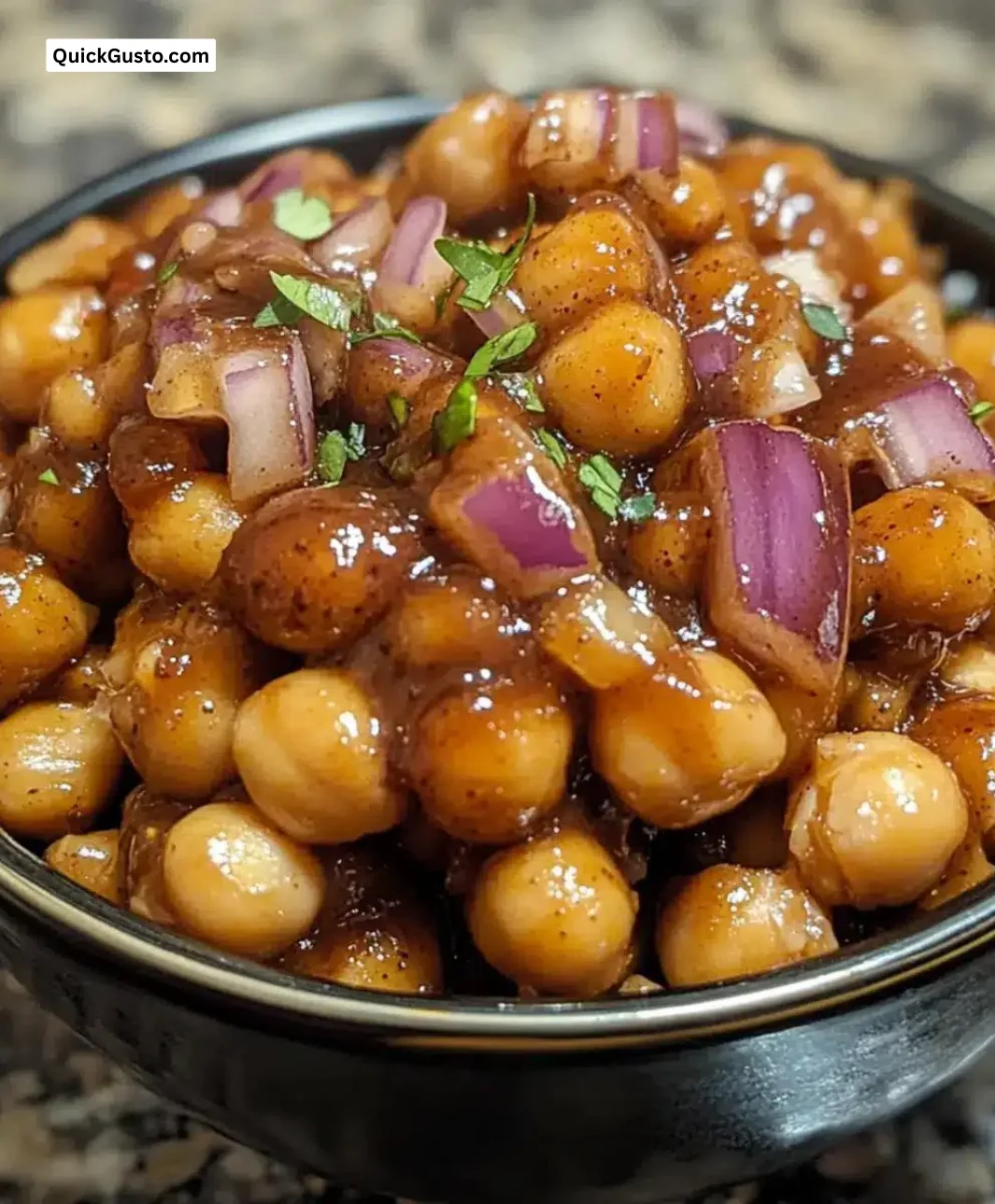 Bowl of easy slow cooker BBQ chickpeas garnished with herbs