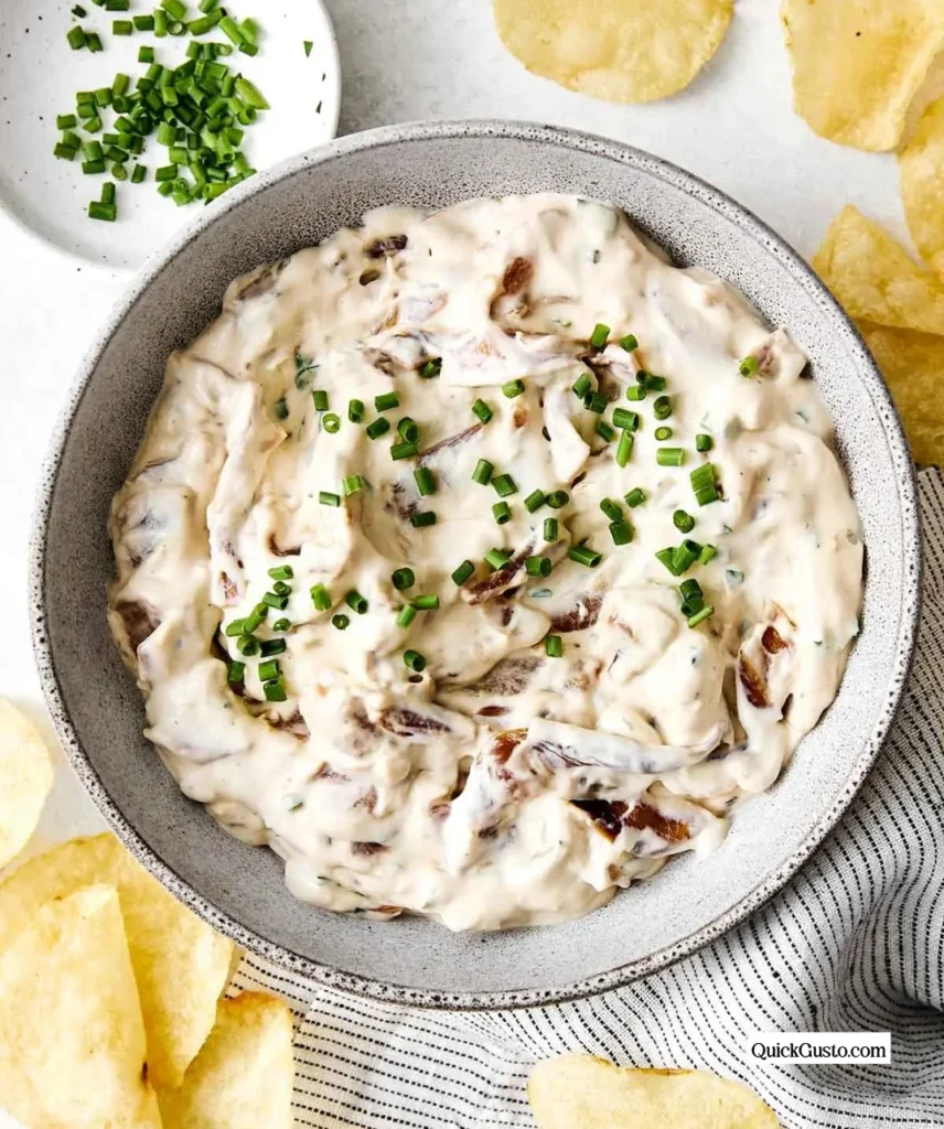 Homemade French Onion Dip served with chips and vegetables.