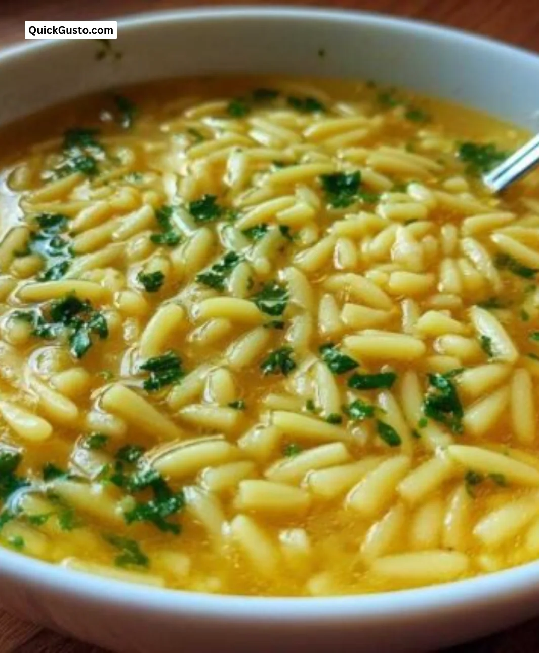 Bowl of Italian Penicillin Soup garnished with herbs and ingredients