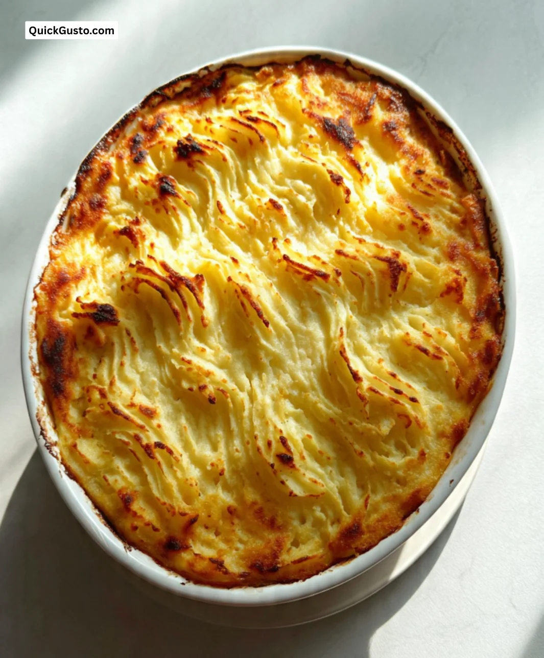 Low FODMAP cottage pie dish topped with creamy mashed potatoes