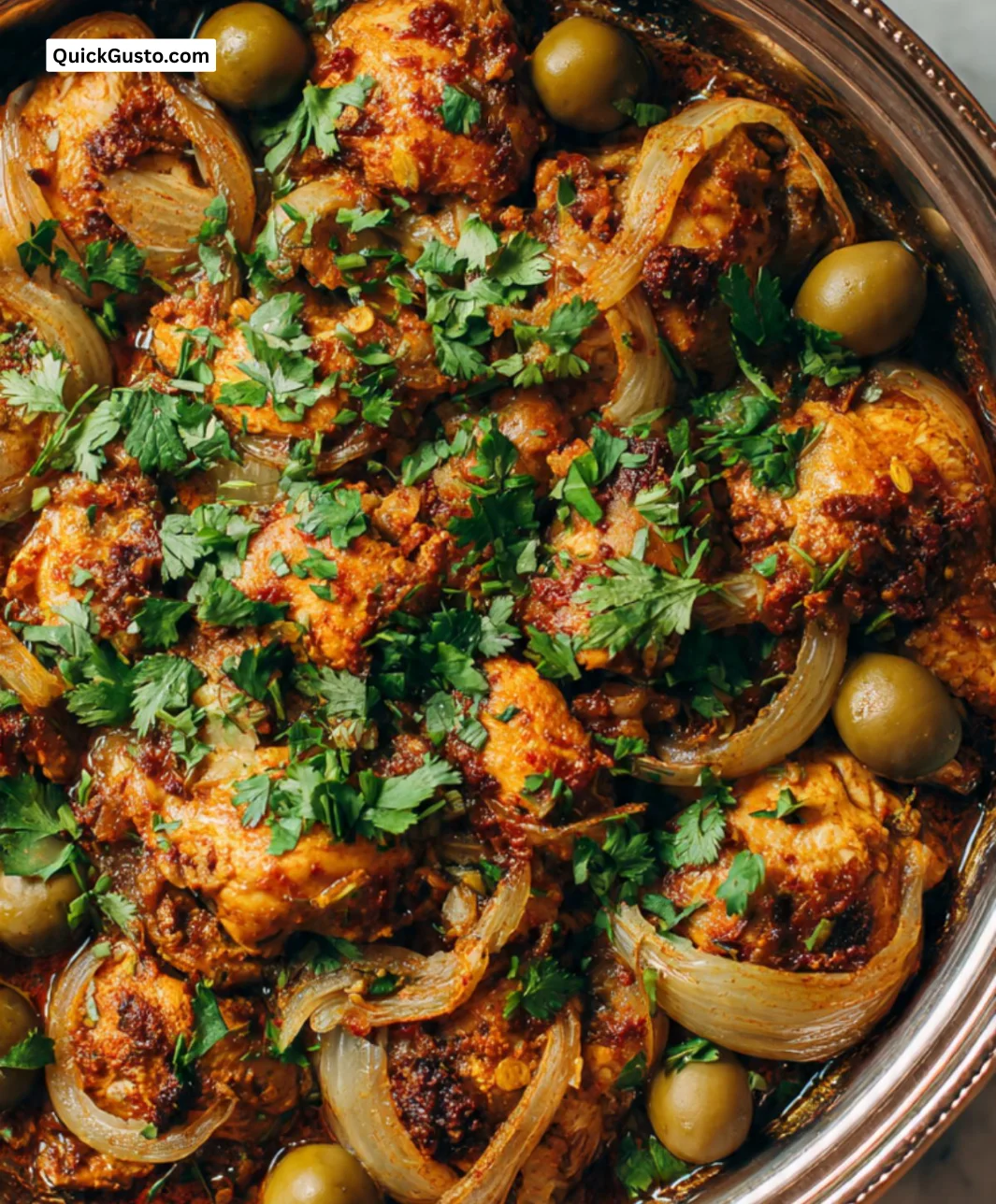 Delicious Moroccan Chicken Tagine served with spices and garnished with herbs