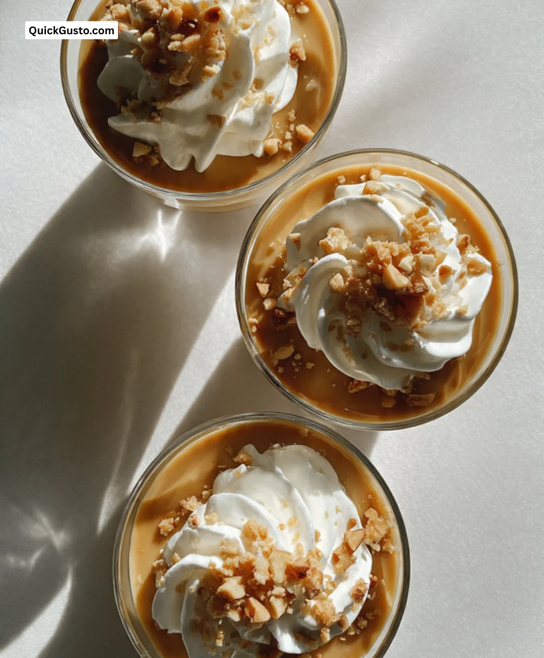 Delicious homemade salted caramel puddings served in elegant dessert cups