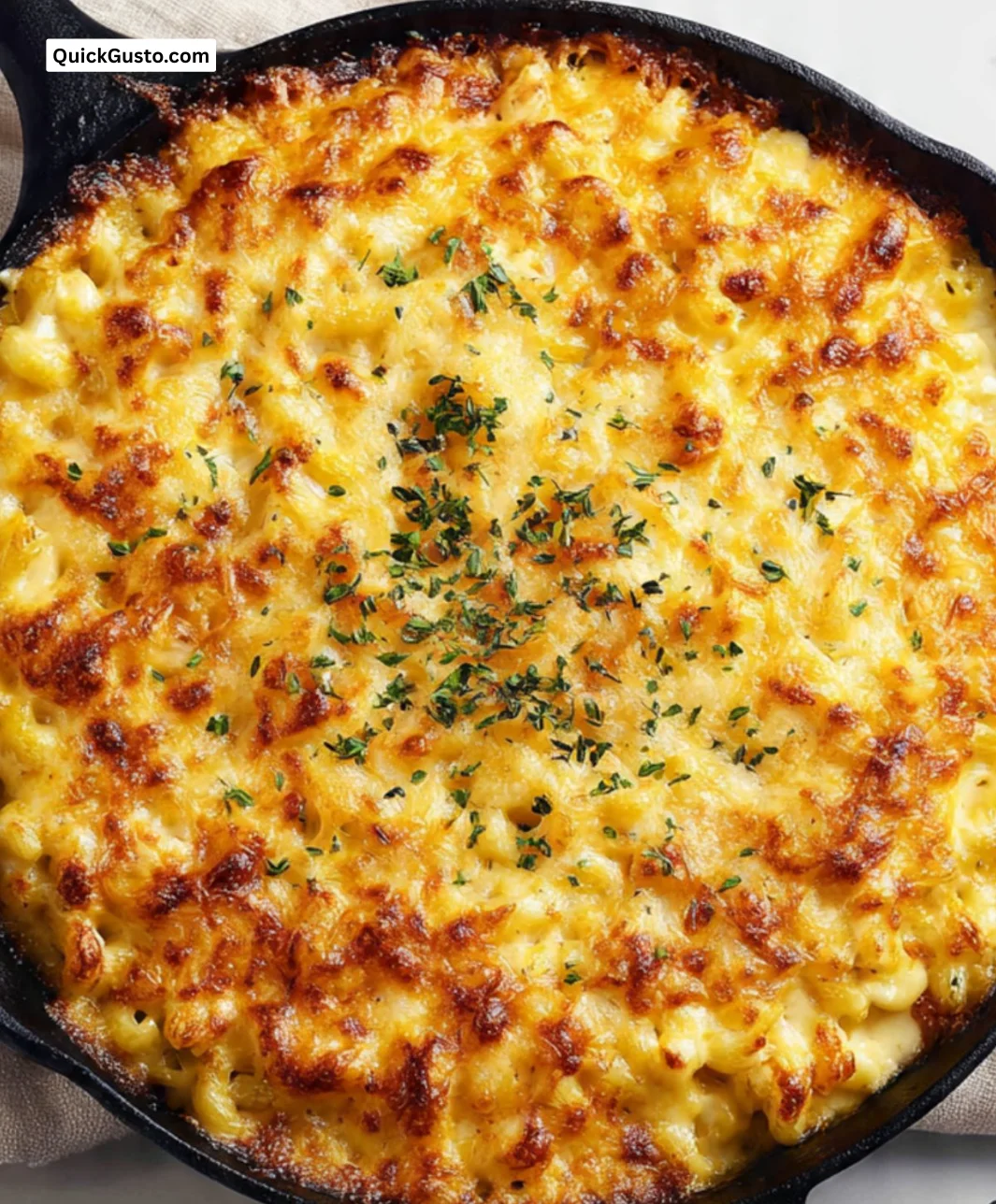 Creamy smoked macaroni and cheese in a bowl, topped with crispy breadcrumbs