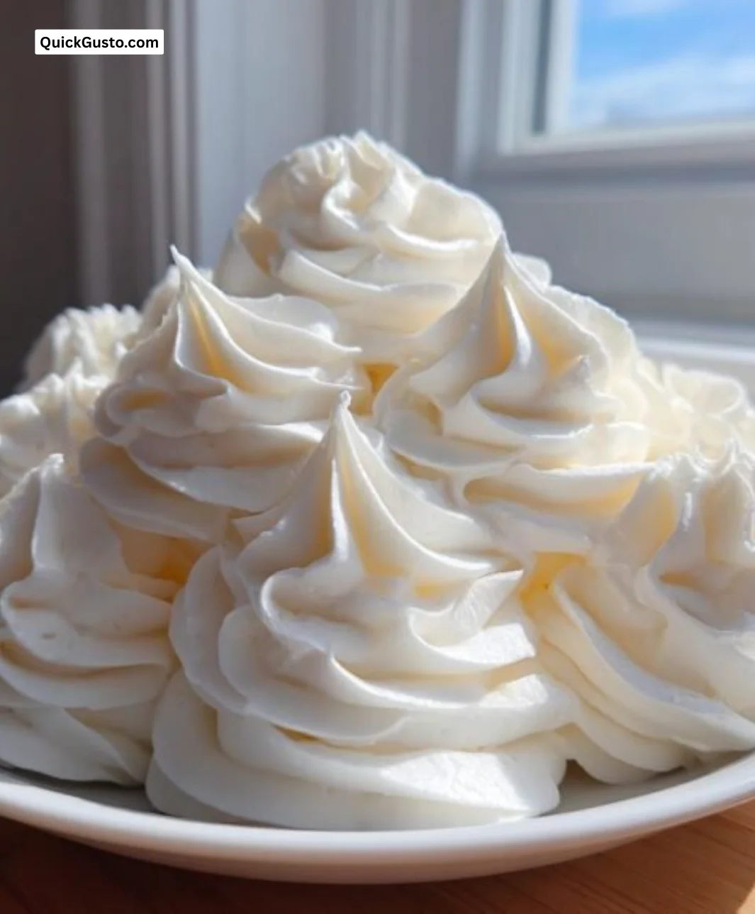 Delicious vanilla buttercream frosting in a mixing bowl