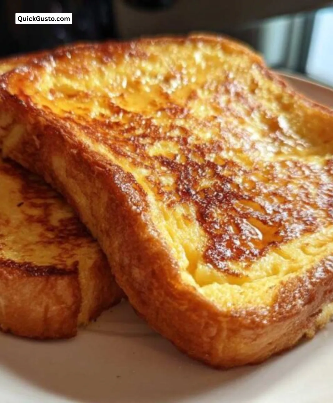 Delicious plate of amazing sourdough French toast topped with fresh fruit and syrup