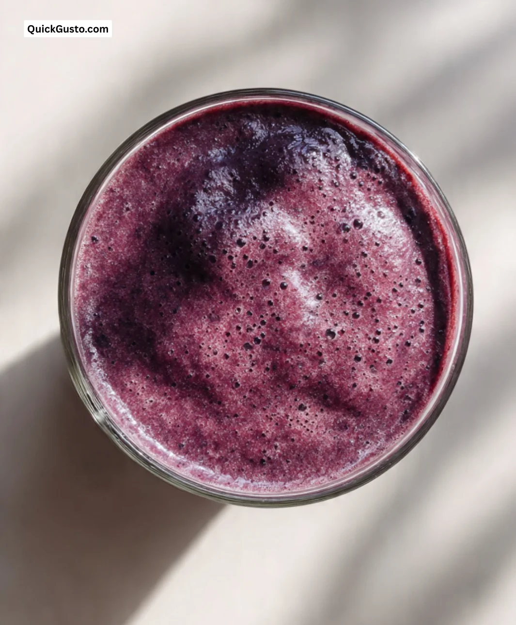 Blueberry and Banana Power Smoothie in a glass with fresh fruits