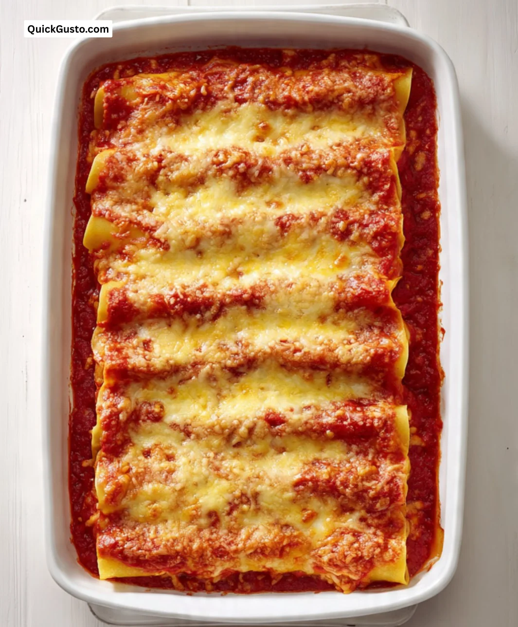 Delicious cannelloni filled with ricotta and spinach, topped with marinara sauce