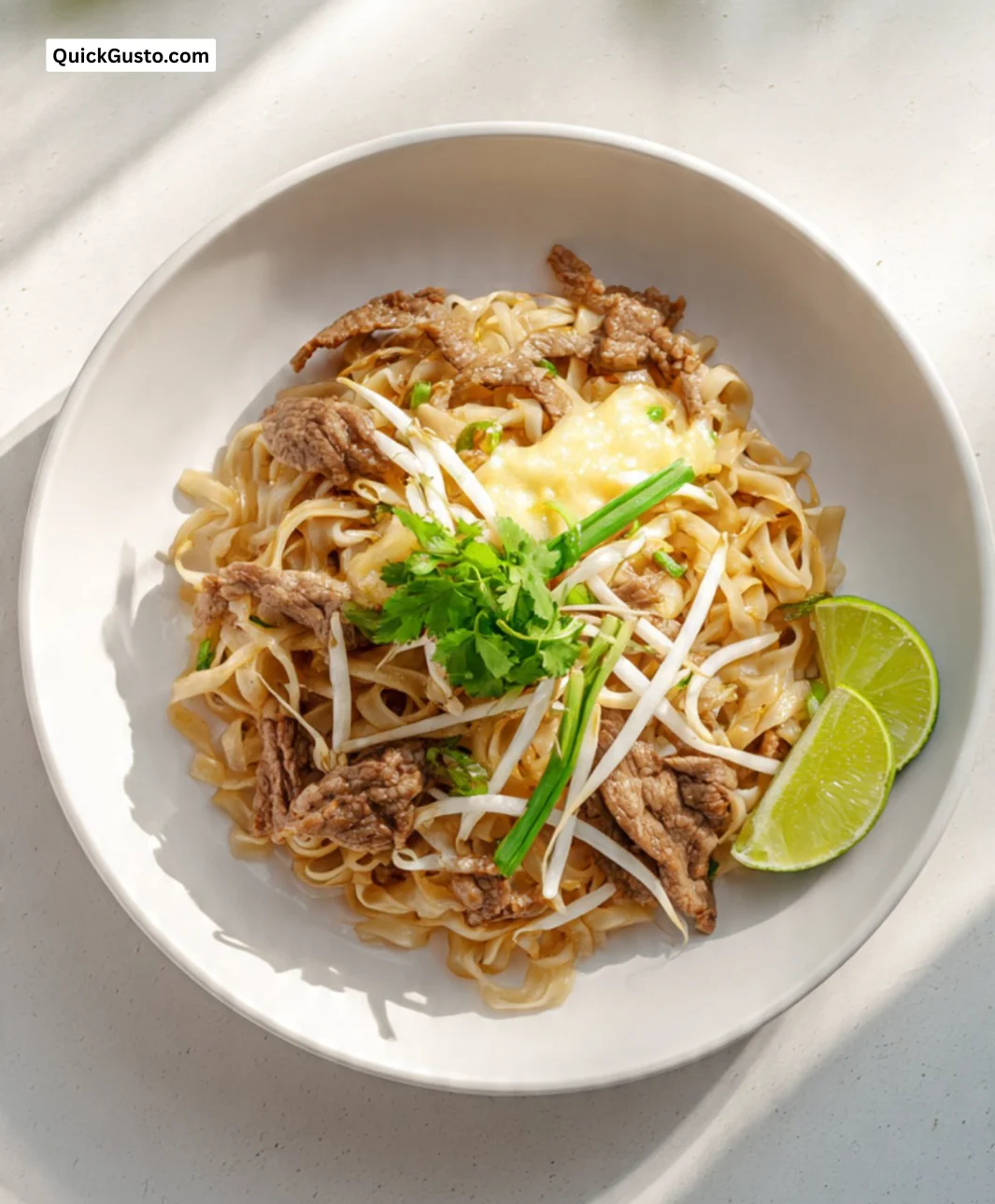 Delicious Cheesy Fried Pho with Mozzarella and Beef served in a bowl