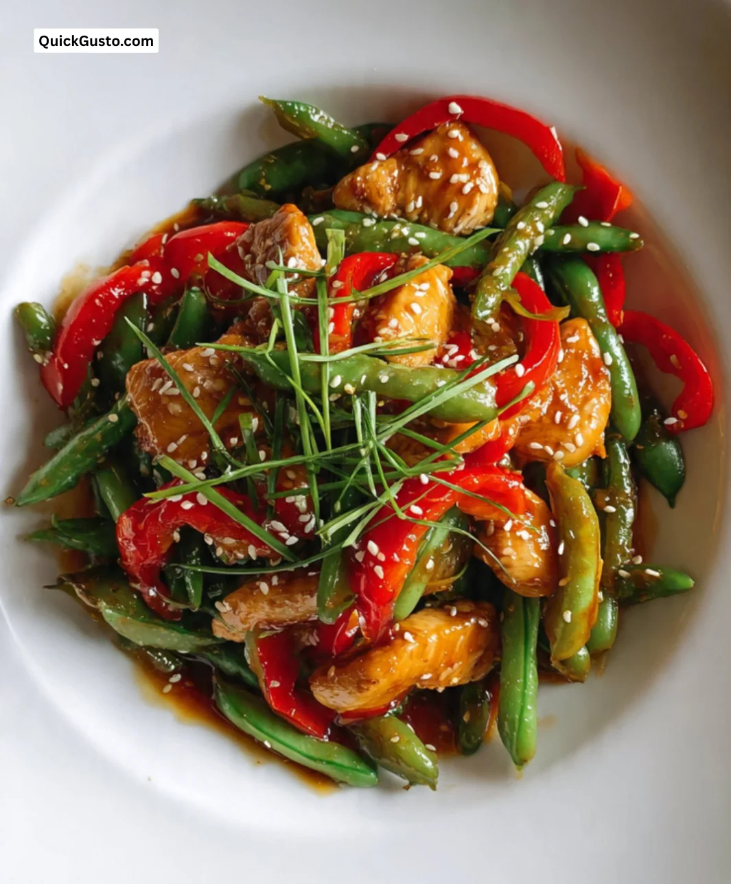 Delicious chicken and snap pea stir fry garnished with sesame seeds