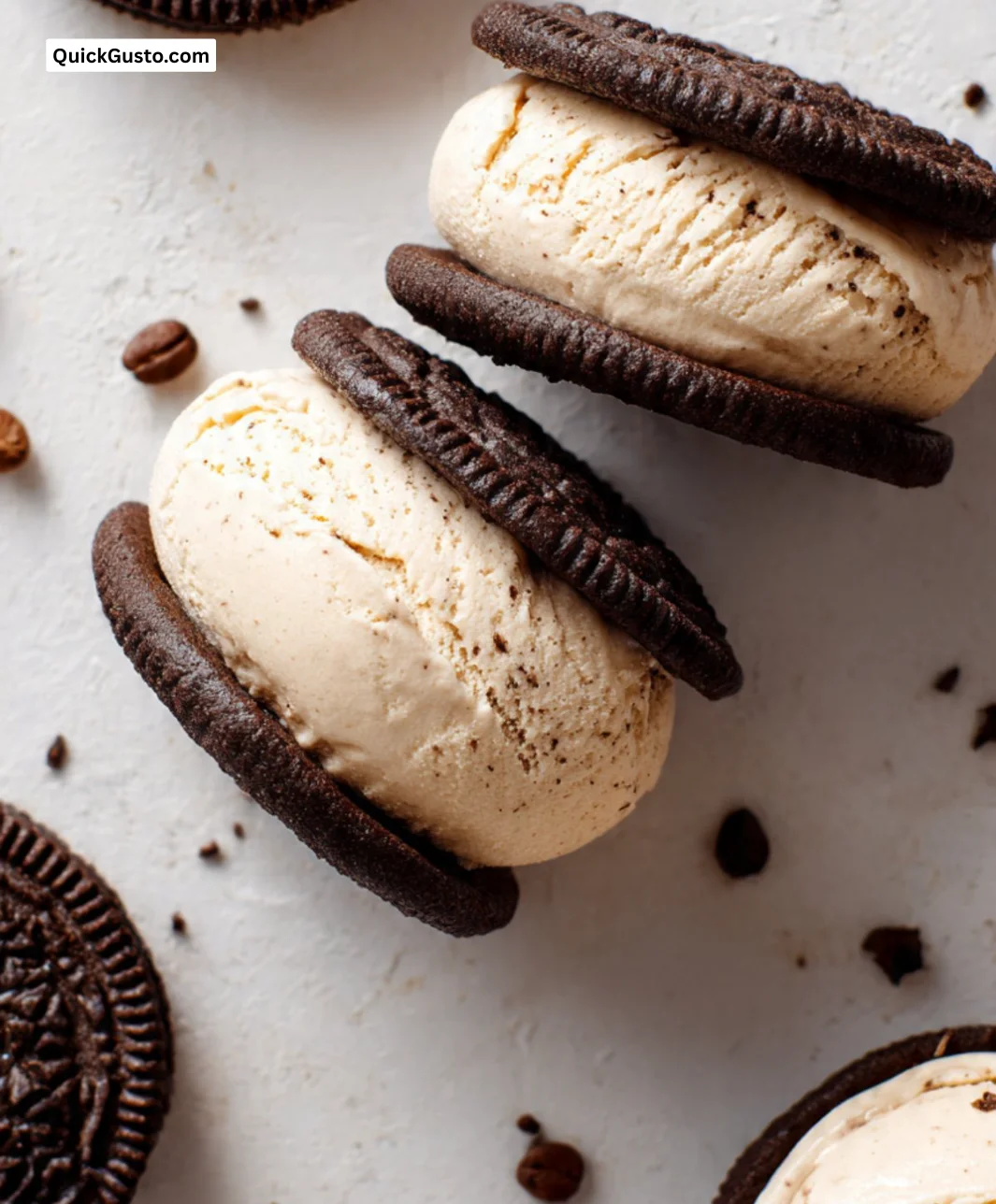 Delicious coffee ice cream sandwich cookies stacked on a plate.