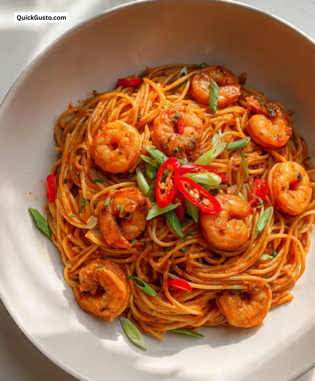 Creamy Gochujang pasta with prawns served in a bowl.