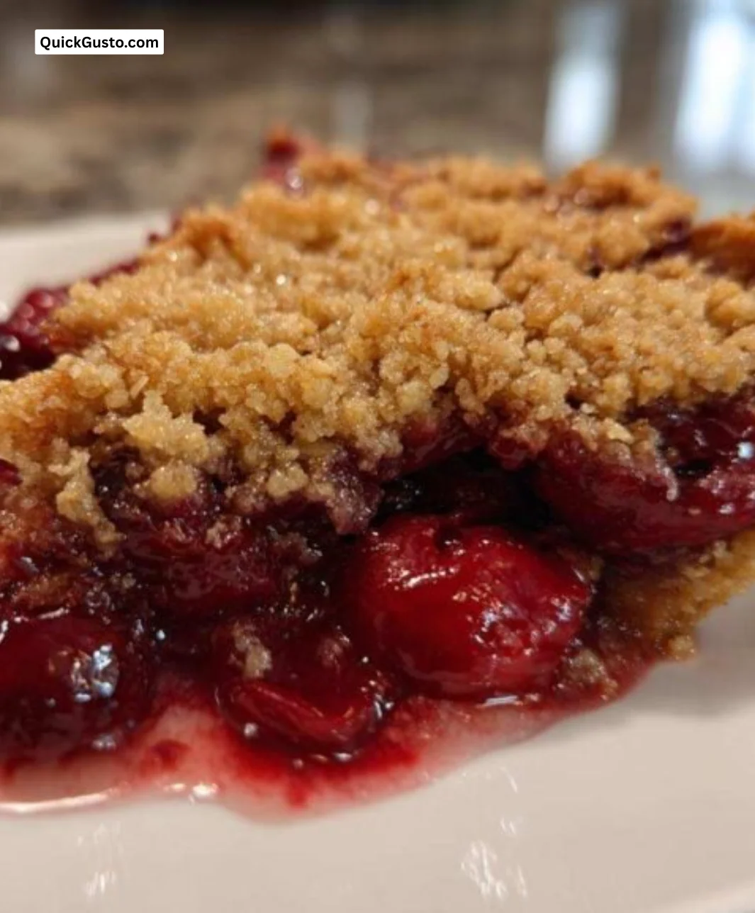 Delicious 3-Ingredient Cherry Dump Cake served on a dessert plate