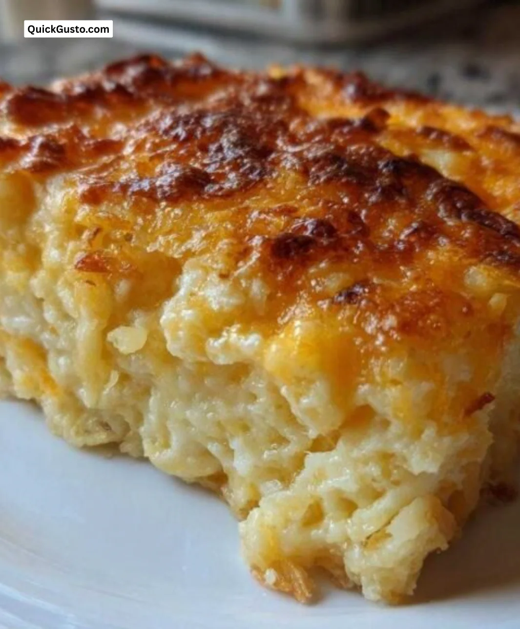 Delicious cheesy potato casserole topped with golden cheese and crispy edges.