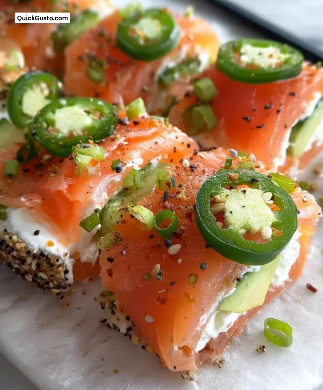 Easter smoked salmon and cream cheese roll ups served on a platter.