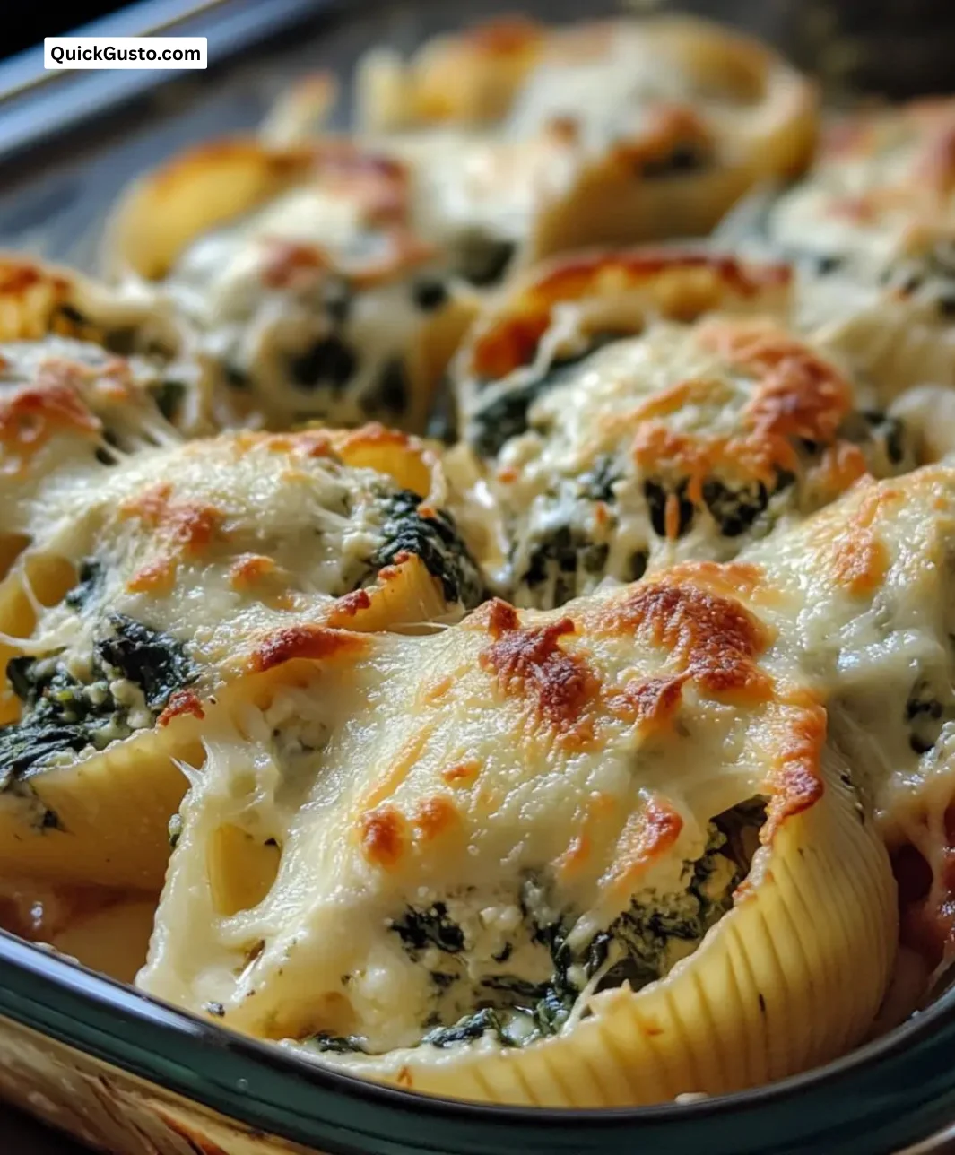 Creamy spinach stuffed shells filled with ricotta and topped with marinara sauce