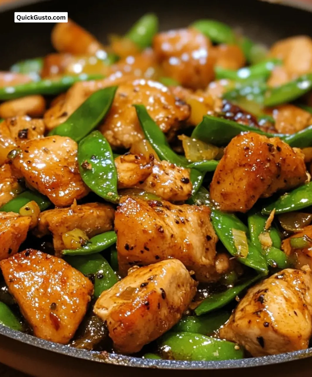 Easy ginger chicken and snow pea skillet recipe in a colorful dish