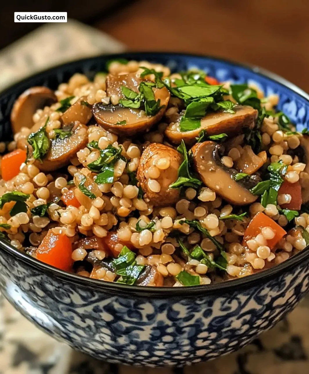 Bowl of Easy Gluten-Free Buckwheat Mushroom Pilaf garnished with herbs