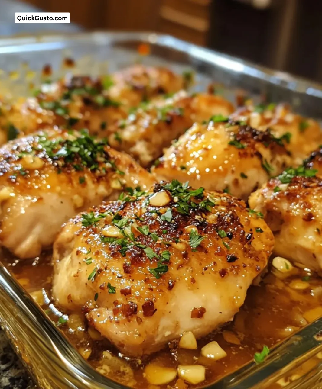 Baked honey garlic chicken served with vegetables on a plate.