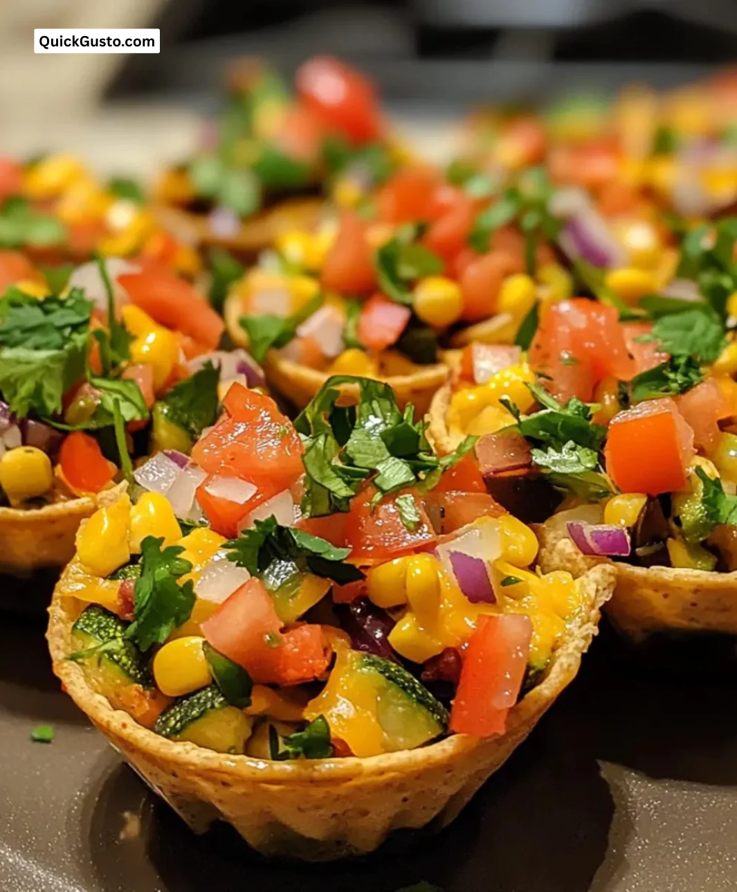 Easy loaded veggie nacho cups topped with colorful veggies and cheese