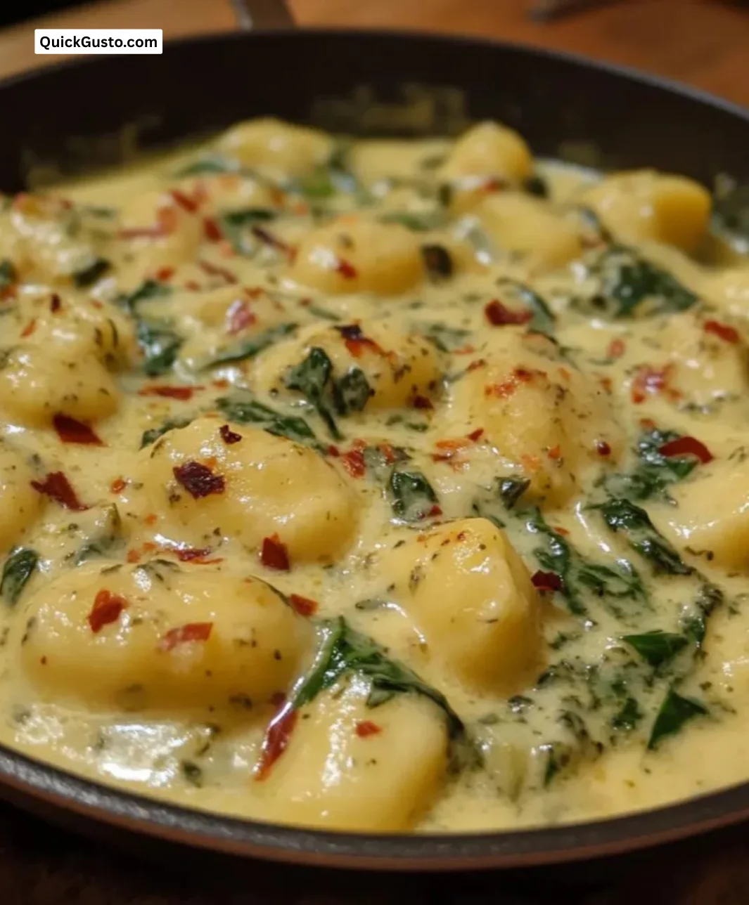 Easy one-pan creamy spinach gnocchi served with fresh herbs