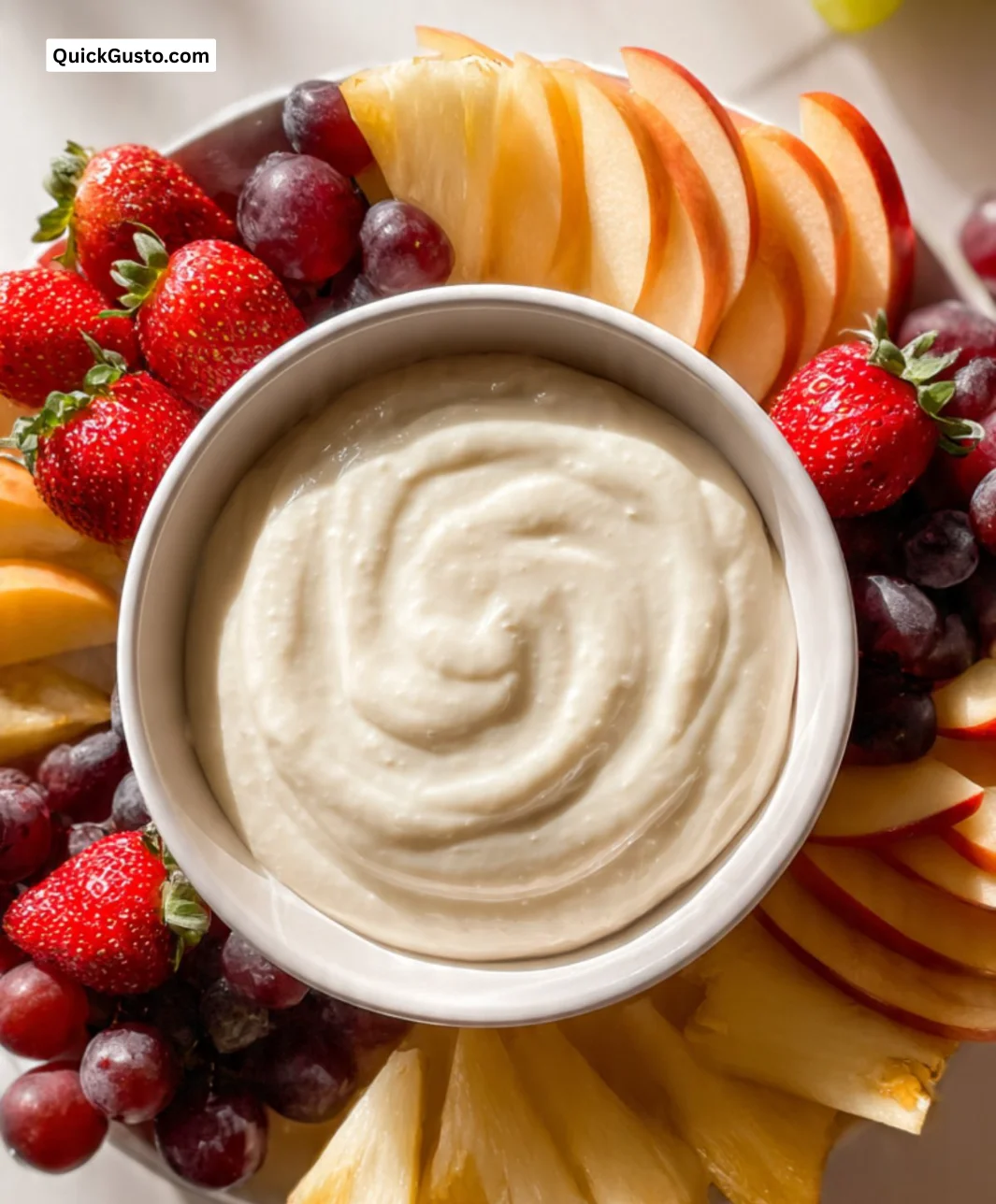Delicious fruit dip served with fresh fruit in a colorful bowl.