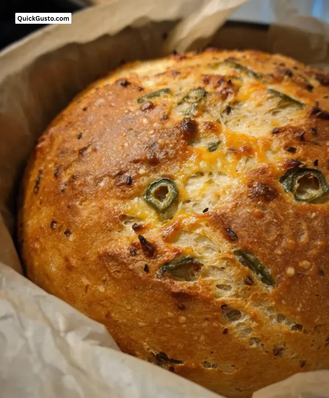 Freshly baked Green Chili Cheese Bread topped with melted cheese and green chilies