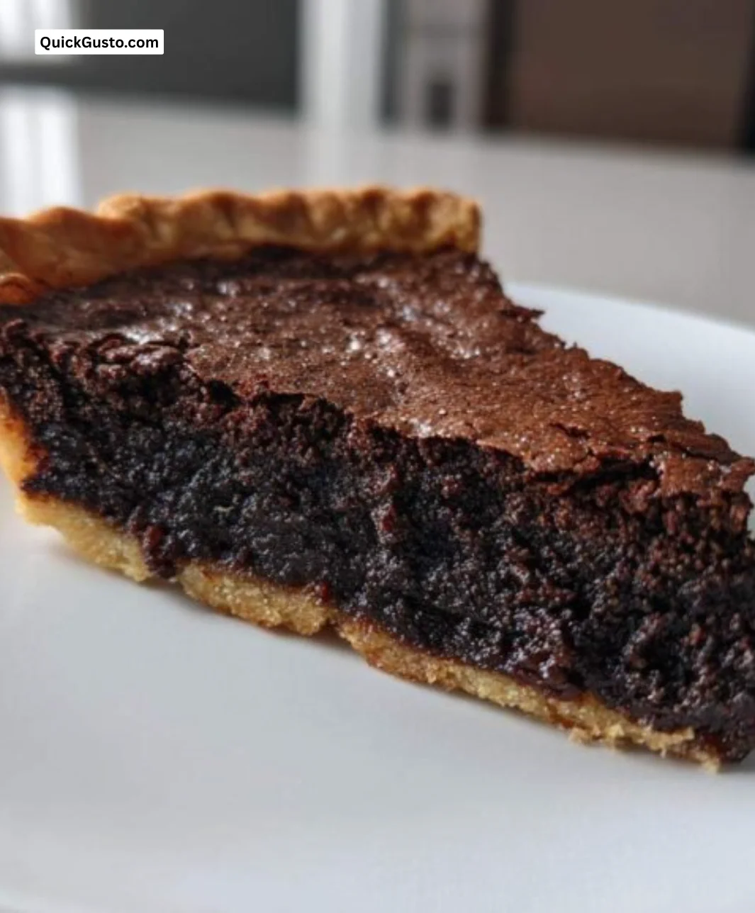 Delicious slice of Hot Fudge Pie Brownie Bliss topped with chocolate sauce