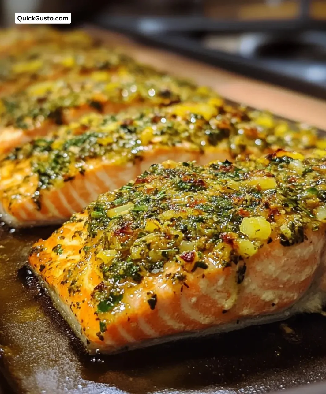 Honey mustard herb-crusted salmon dish served with vegetables on a plate