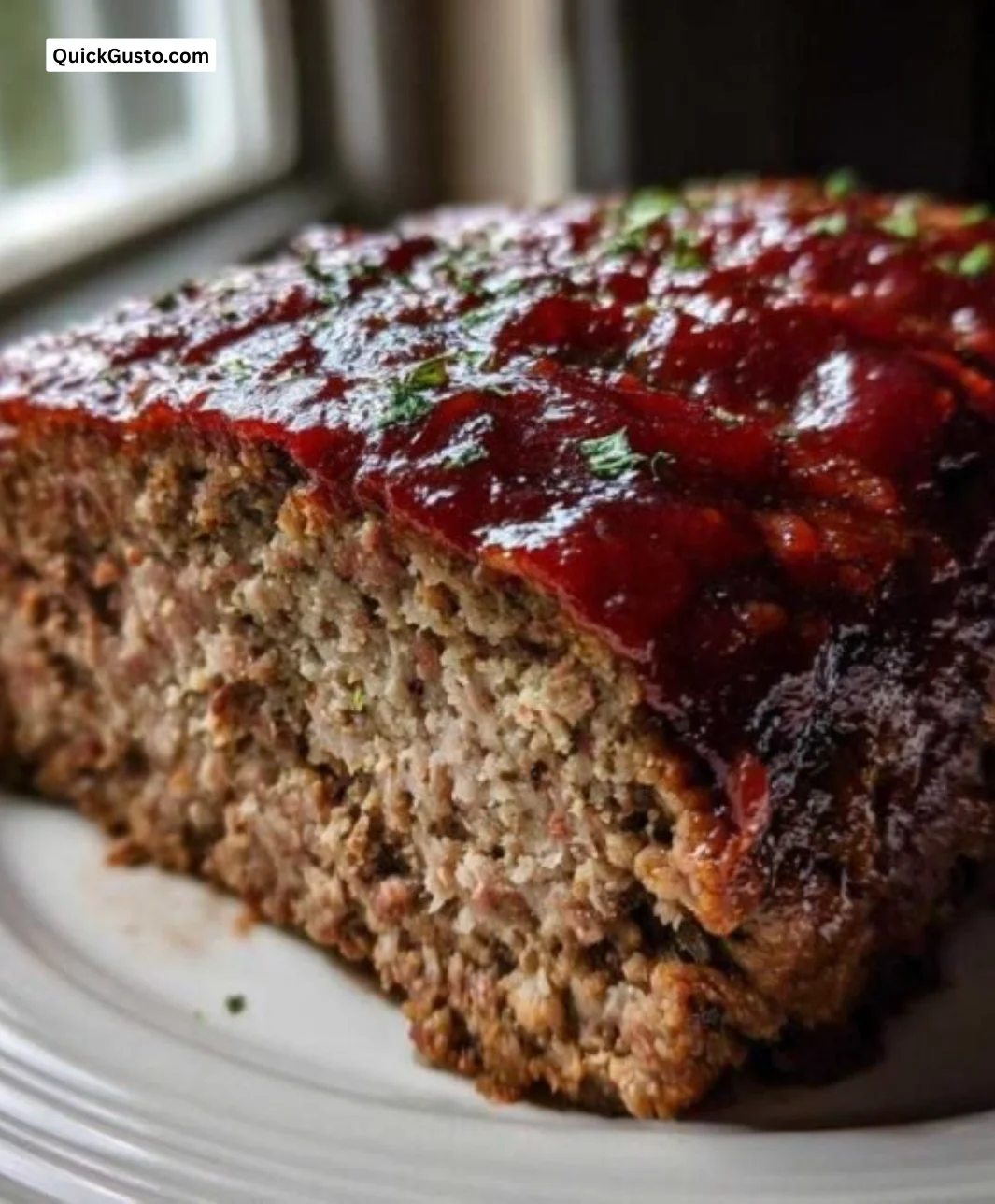 Delicious, juicy meatloaf served with mashed potatoes and green beans