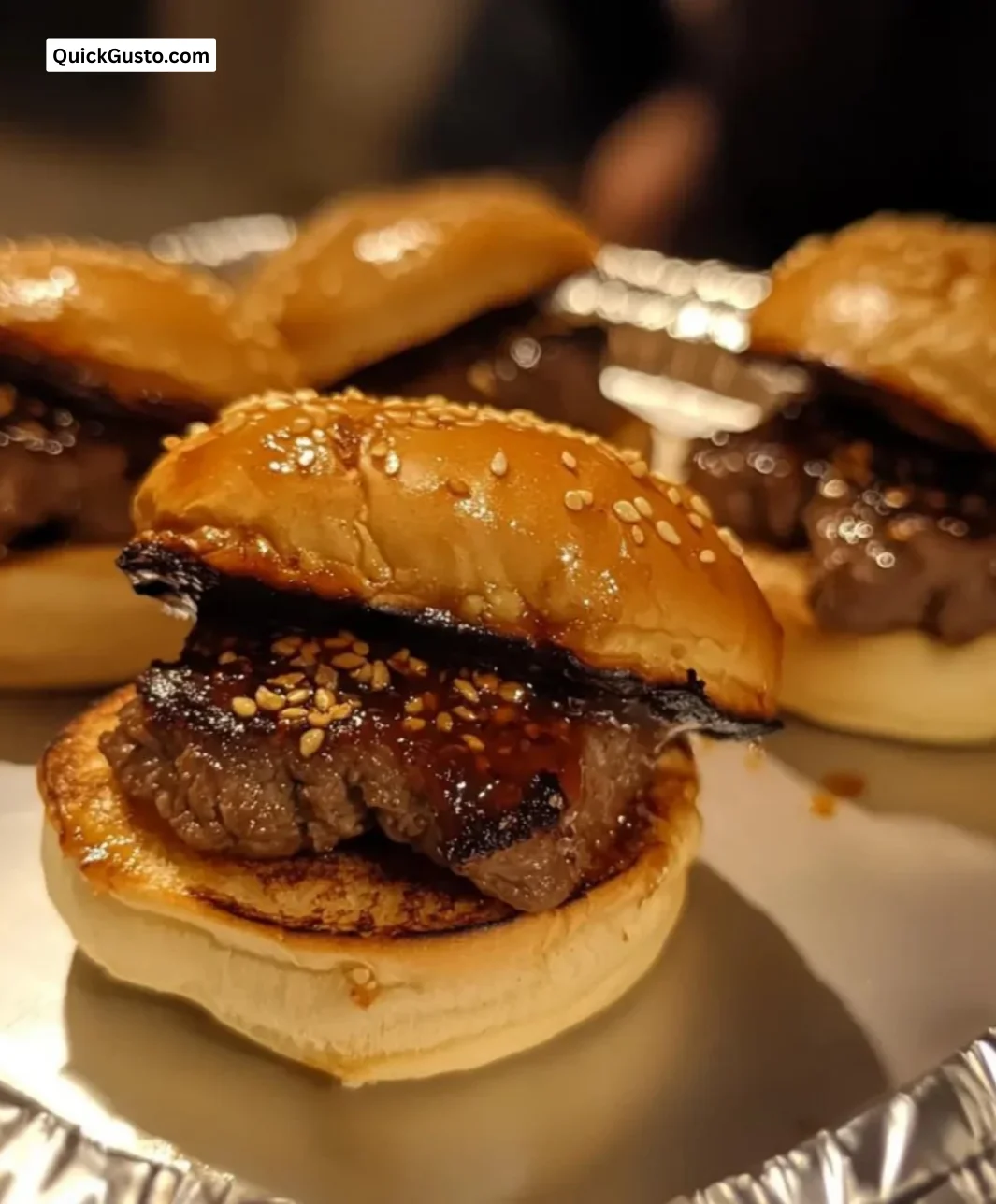 Juicy spicy Korean beef sliders served with fresh toppings and sauce