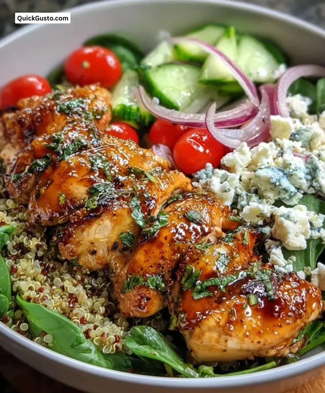 Lemon Herb Grilled Chicken Quinoa Bowl with fresh vegetables and herbs