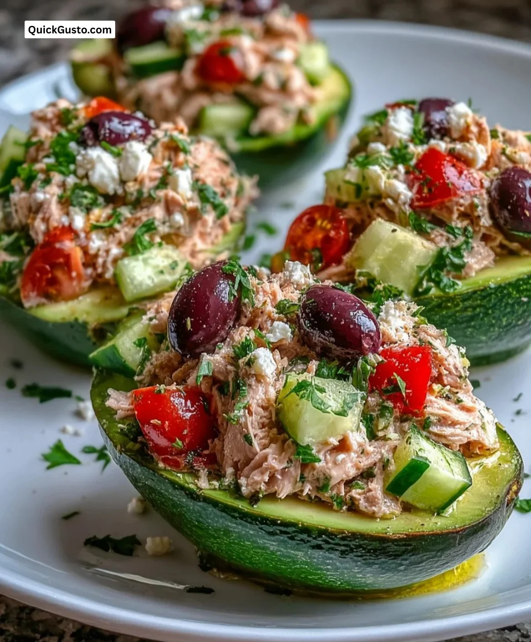 Mediterranean Tuna Salad stuffed in avocado halves for a nutritious meal