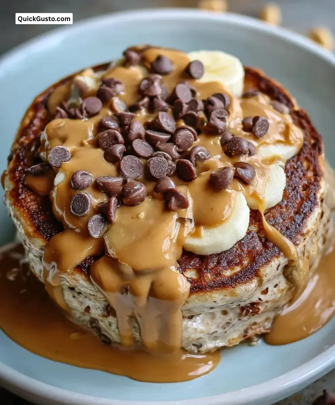 Delicious Peanut Butter Cup Protein Pancake Bowl topped with creamy peanut butter