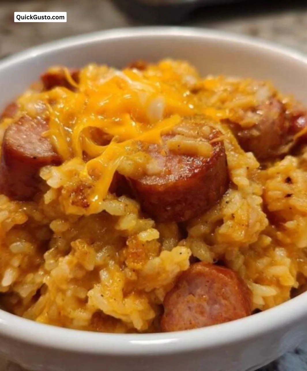 Delicious sausage and rice dish served in a bowl, perfect for a quick dinner.