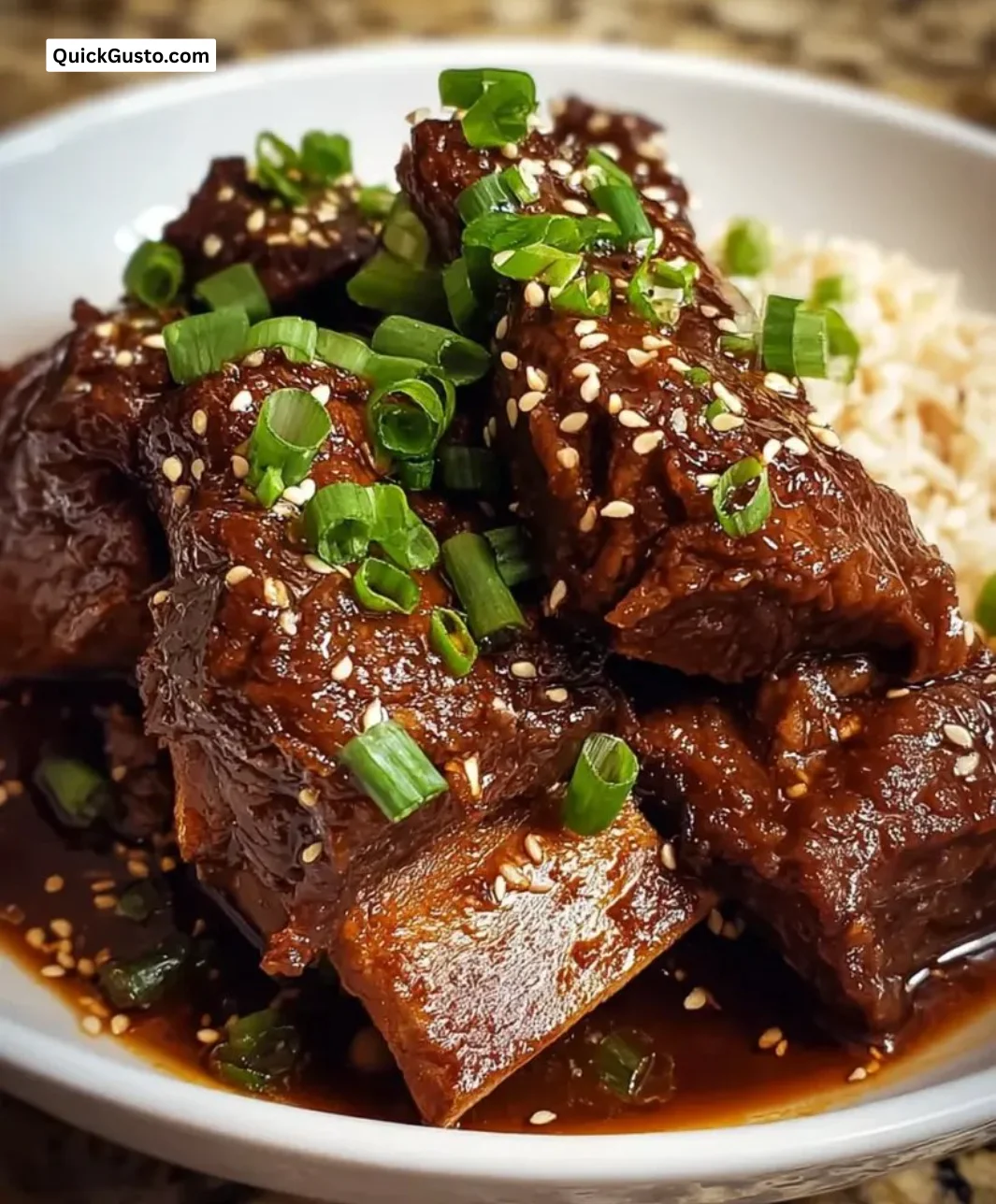 Slow Cooker Korean Short Ribs served with garnish and side dishes