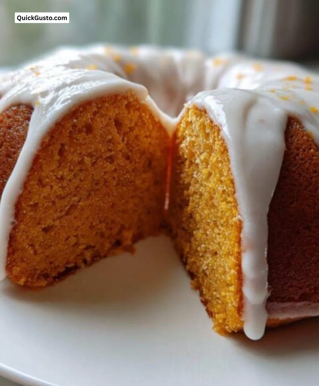 Delicious slice of sweet potato pound cake topped with cream.