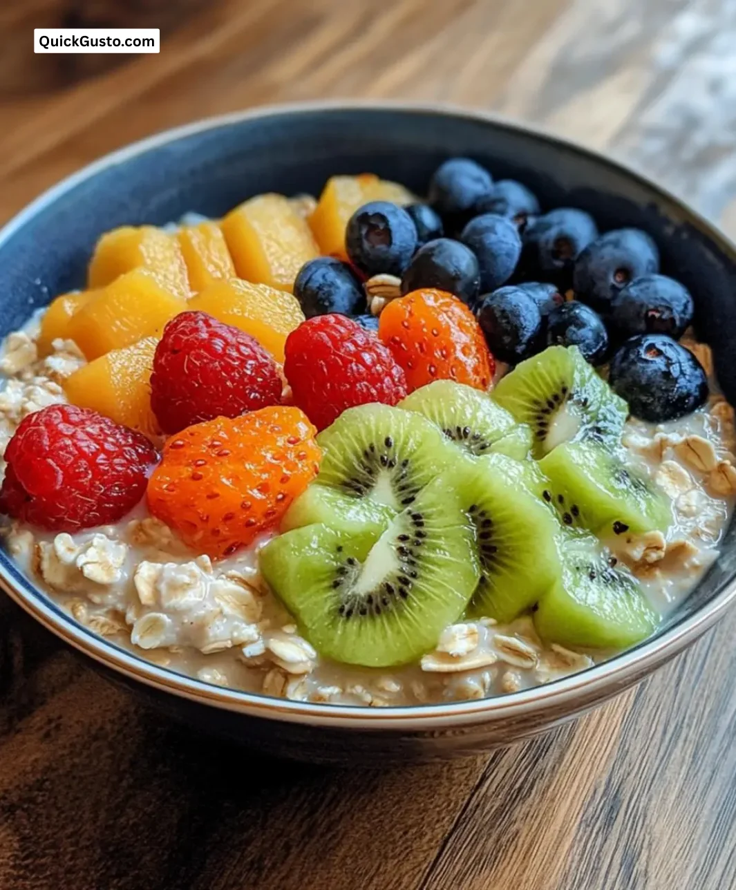 Delicious bowl of creamy oatmeal topped with fresh fruits